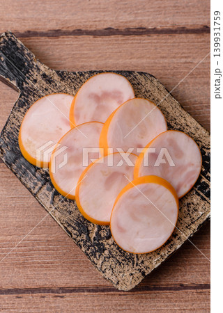 Slices of cooked chicken sausage for sandwiches and antipasto for dinner. Sausage slices 139931759