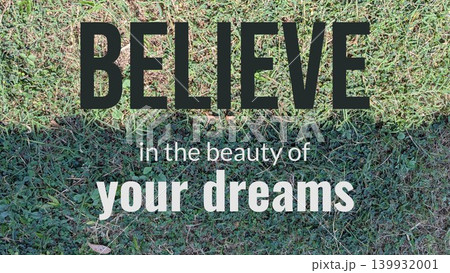 A motivational quote against a backdrop of a neatly cut lawn with an exposed patch of dirt in the foreground. The text states "BELIEVE in the beauty of your DREAMS." A motivational quote against a backdrop of a neatly cut lawn with an exposed patch of dirt in the foreground. The text states "BELIEVE in the beauty of your DREAMS." 139932001