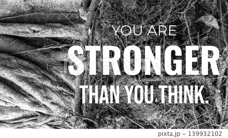 A black and white image of a tree's exposed root system. The thick, twisting roots on the left contrast with the tangled, finer roots and dirt on the right. A quote "YOU ARE STRONGER THAN YOU THINK." 139932102