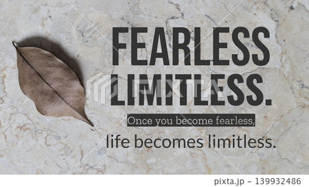 Beige marble serves the background for a motivational quote. A single, dried brown leaf rests in the corner, with the words "FEARLESS LIMITLESS" and "Once you become fearless, life becomes limitless". Beige marble serves the background for a motivational quote. A single, dried brown leaf rests in the corner, with the words "FEARLESS LIMITLESS" and "Once you become fearless, life becomes limitless". 139932486