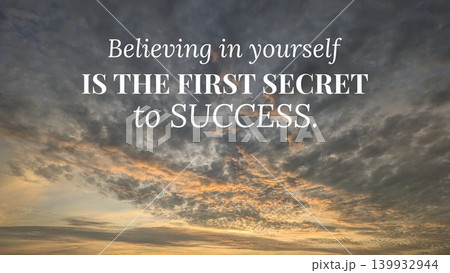 An uplifting image with the quote "Believing in yourself IS THE FIRST SECRET to SUCCESS" superimposed over a sky filled with dramatic clouds at sunrise. The clouds are dark gray and golden. 139932944