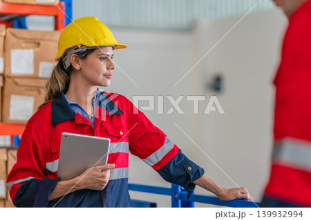 Warehouse worker working in warehouse storage. Warehouse worker working in warehouse storage. 139932994