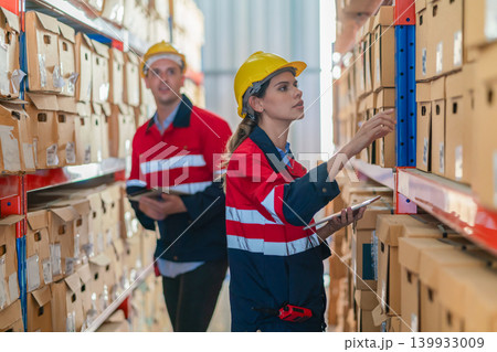 Warehouse worker working in warehouse storage. Warehouse worker working in warehouse storage. 139933009