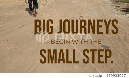 A pair of feet walk along a dusty path, with the phrase "BIG JOURNEYS BEGIN WITH THE SMALL STEP." superimposed over the image. The photo has an inspirational and contemplative feel. 139933027