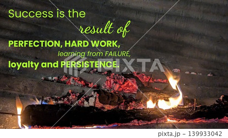 A fiery inferno erupts from a smoldering structure with a corrugated metal roof. The flames and glowing embers are overlaid with an inspirational quote about success, perfection, hard work. A fiery inferno erupts from a smoldering structure with a corrugated metal roof. The flames and glowing embers are overlaid with an inspirational quote about success, perfection, hard work. 139933042