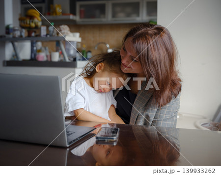 Remote Working Mother Balancing Home and Career 139933262