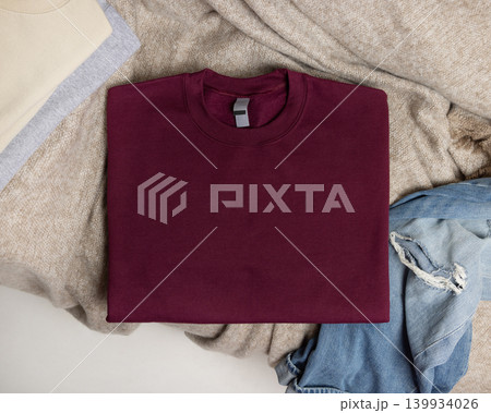 Blank dark red unisex sweatshirt mockup, folded crewneck casual flat lay with copy space on front Blank dark red unisex sweatshirt mockup, folded crewneck casual flat lay with copy space on front 139934026