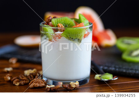 delicious yogurt snack with kiwi grapefruit and nuts closeup 139934255