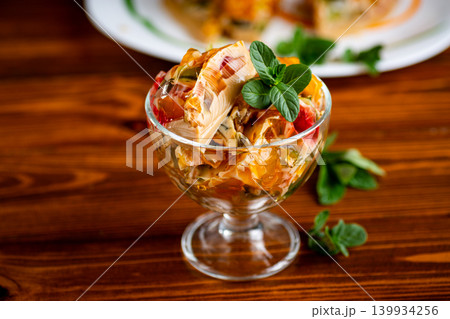 layered coffee fruit jelly dessert in glass bowl with mint layered coffee fruit jelly dessert in glass bowl with mint 139934256