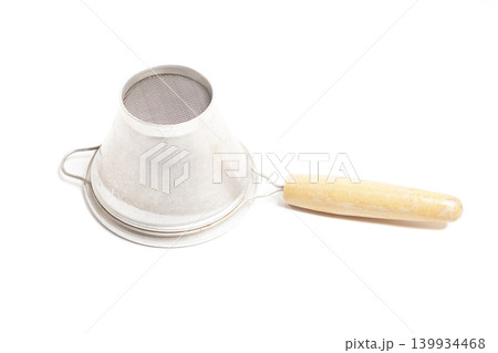 Strainer with wooden handle isolated on white background Strainer with wooden handle isolated on white background 139934468