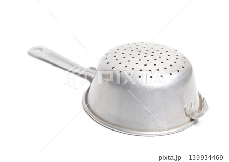 Aluminum colander isolated on white. Cooking utensil. Aluminum colander isolated on white. Cooking utensil. 139934469