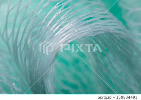 Turquoise shower puff texture background macro mesh bath sponge close up 139934493