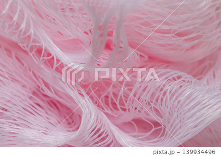 Pink shower puff texture background macro mesh bath sponge close up Pink shower puff texture background macro mesh bath sponge close up 139934496