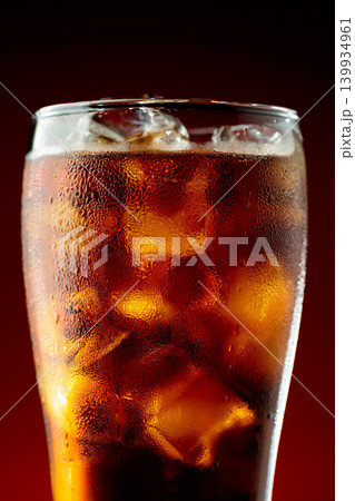 Fizz sparkling cola bubbly soda pop with ice cubes. 139934961