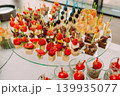 Assorted canapes and finger foods on trays for a holiday buffet 139935077