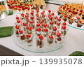 Assorted canapes and finger foods on trays for a holiday buffet 139935078