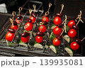 Assorted canapes and finger foods on trays for a holiday buffet 139935081