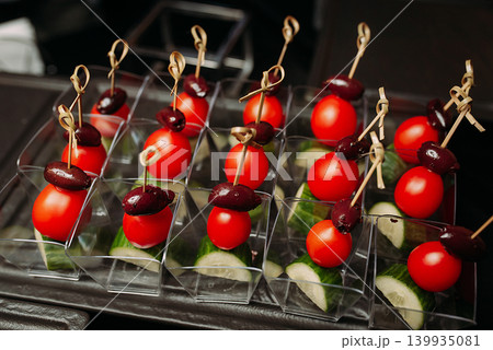 Assorted canapes and finger foods on trays for a holiday buffet Assorted canapes and finger foods on trays for a holiday buffet 139935081