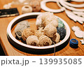 Colorful balls of yarn at handmade craft workshop. Concept of knitting, textile art, creativity, hobby, and artisan lifestyle 139935085