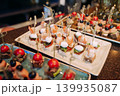Assorted canapes and finger foods on trays for a holiday buffet 139935087