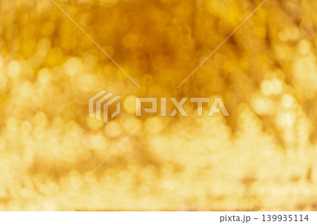 Gold abstract bokeh background and glitter bokeh lights. image is blurred and filtered. Gold abstract bokeh background and glitter bokeh lights. image is blurred and filtered. 139935114
