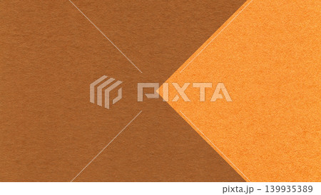 Textured warm brown paper background with orange arrow, macro. Template with copy space for banner, presentation 139935389