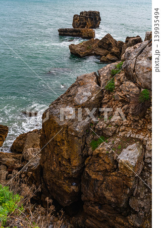 Rocky coastal formations and ocean horizon in Cascais Portugal 139935494