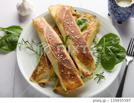 Crispy Savory Crepe Rolls with Herbs and Sesame Crispy Savory Crepe Rolls with Herbs and Sesame 139935597
