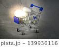 Led light bulbs in a shopping cart on a concrete gray background. 139936116