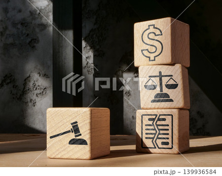 Legal finance symbols on blocks for business compliance planning. Legal finance symbols on blocks for business compliance planning. 139936584