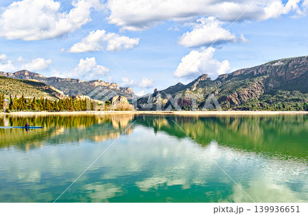 Man kayaking in the reservoir of the Sant Llorenc de Montgai Natural Park, Noguera region, Lleida, Catalonia. Nature, water sports. 139936651