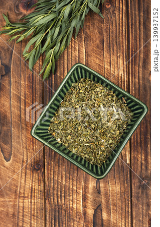 Organic tarragon fresh branches and dried herbs Organic tarragon fresh branches and dried herbs 139937152