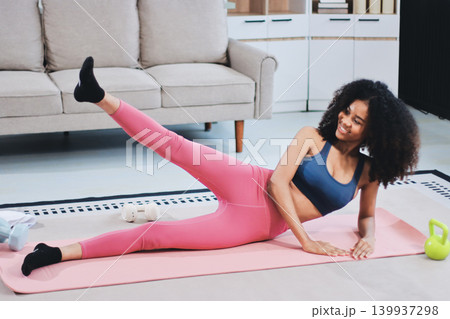 Women exercising in fitness studio yoga classes Women exercising in fitness studio yoga classes 139937298