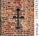 Red brick wall texture with black metal anchor plate 139937819