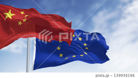 Flags of China and European Union waving in the wind on a clear day Flags of China and European Union waving in the wind on a clear day 139938198