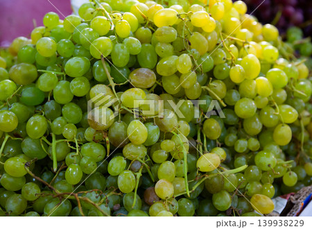 Ripe white grapes in clusters as background Ripe white grapes in clusters as background 139938229