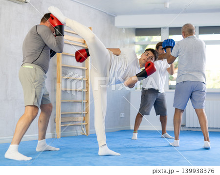 Opponent punches enemy with his feet and hands, using all his strength, courage, and courage 139938376