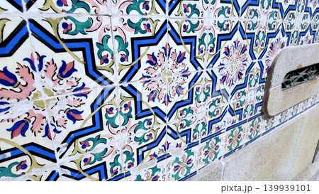Traditional Portuguese Azulejo Tiles with Blue Geometric Stars and Pink Floral Centers Traditional Portuguese Azulejo Tiles with Blue Geometric Stars and Pink Floral Centers 139939101