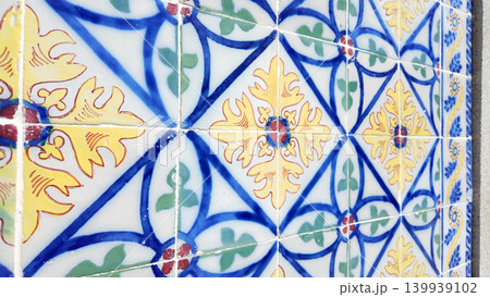 Traditional Portuguese Azulejo Tiles with Yellow Floral and Blue Geometric Motifs 139939102