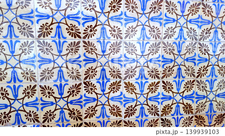 Traditional Portuguese Azulejo Tile Wall with Blue and Brown Floral Patterns 139939103