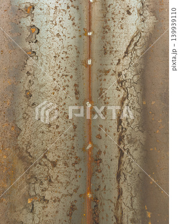 Rusted Steel Plate with Vertical Weld Seam and Heavy Oxidation Patterns Rusted Steel Plate with Vertical Weld Seam and Heavy Oxidation Patterns 139939110