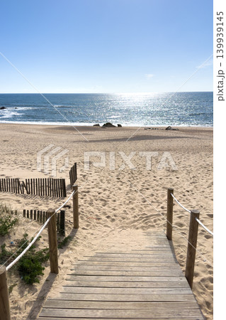 Wooden Boardwalk Path Leading to Sunlit Miramar Beach in Gaia Portugal Wooden Boardwalk Path Leading to Sunlit Miramar Beach in Gaia Portugal 139939145