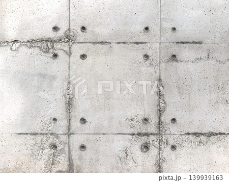 Industrial Weathered Exposed Concrete Wall with Tie Rod Holes 139939163