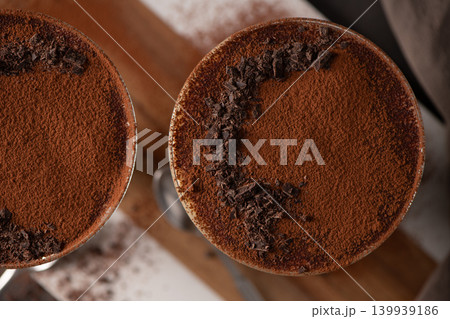Top View of Tiramisu Desserts Dusted with Cocoa Powder and Dark Chocolate Shavings Top View of Tiramisu Desserts Dusted with Cocoa Powder and Dark Chocolate Shavings 139939186