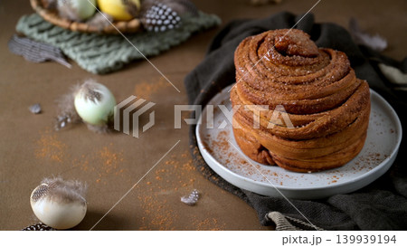 Gourmet Cinnamon Roll with Easter Table Setting and Spring Decor Gourmet Cinnamon Roll with Easter Table Setting and Spring Decor 139939194