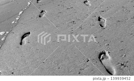Following footprints on Beach Shore Following footprints on Beach Shore 139939452
