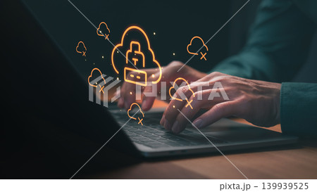 Hands typing on a laptop with cloud computing and cybersecurity icons for data protection, network security, and privacy. Essential technology for online safety and cloud storage. Hands typing on a laptop with cloud computing and cybersecurity icons for data protection, network security, and privacy. Essential technology for online safety and cloud storage. 139939525