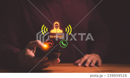 Hand using smartphone to block scam call. Cyber security protection against fraud, phishing, and hacker threats. Mobile phone user stopping spam. Hand using smartphone to block scam call. Cyber security protection against fraud, phishing, and hacker threats. Mobile phone user stopping spam. 139939528