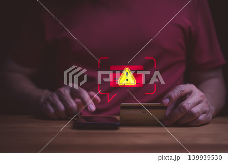 Credit card fraud alert and cyber security concept. User on smartphone with online payment scam warning. Phishing, identity theft, hacked banking account, and data protection risk. Credit card fraud alert and cyber security concept. User on smartphone with online payment scam warning. Phishing, identity theft, hacked banking account, and data protection risk. 139939530
