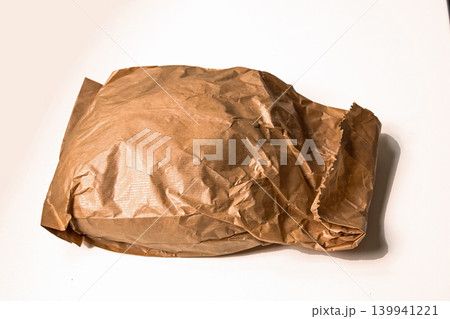 Full paper bag on table Full paper bag on table 139941221